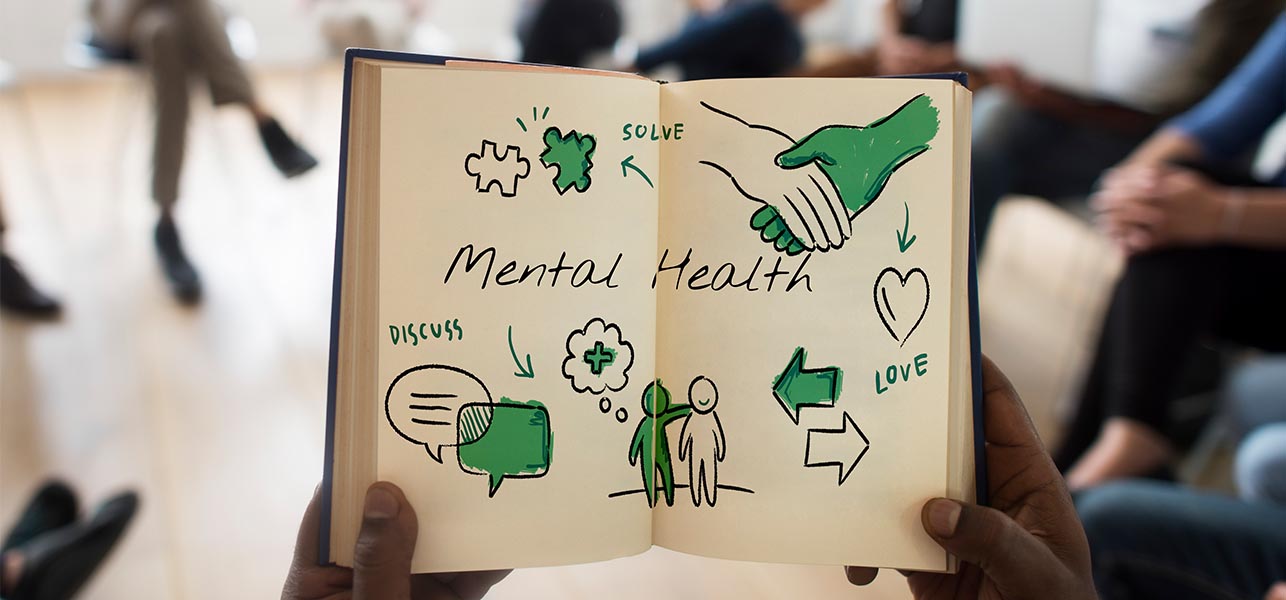 hands holding mental health illustration in a session